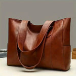 Sophia's Luxe Legacy premium leather handbag shown in Coffee and Black