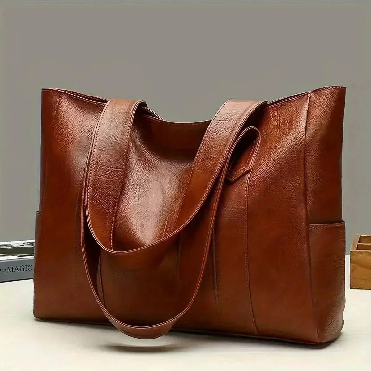 Sophia's Luxe Legacy premium leather handbag shown in Coffee and Black