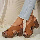 Pula Sunset platform sandals with block heel, crisscross straps and metallic rivet accents