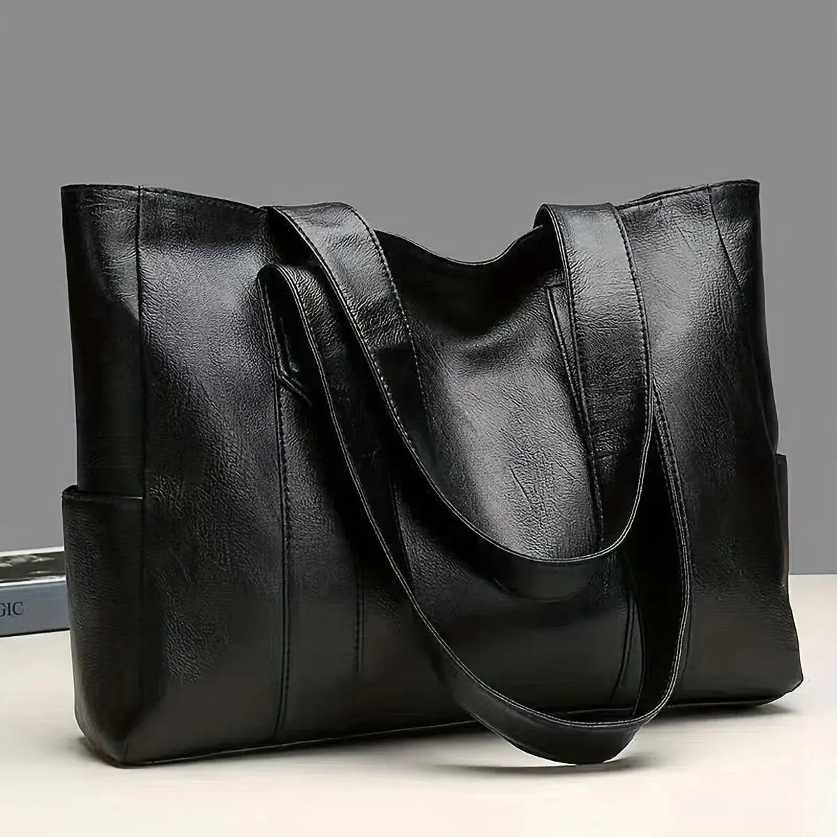 Sophia's Luxe Legacy premium leather handbag shown in Coffee and Black
