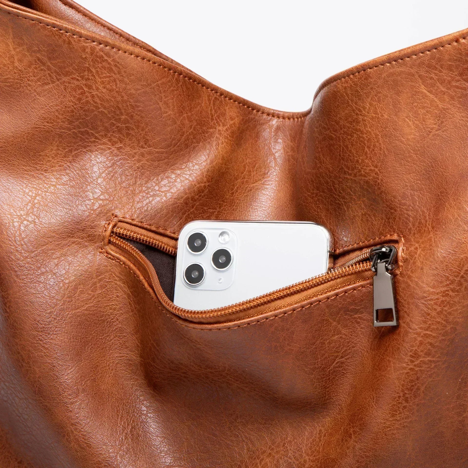 Evening Glow luxe leather shoulder bag shown in a rich neutral colour
