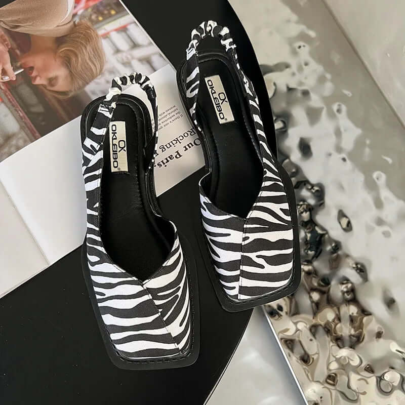 Sandy square toe slip-on flats with elastic back support in beige, black, green and zebra