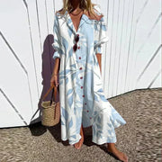 Rema beachcomber boho dress with deep V-neckline and flowing layered skirt