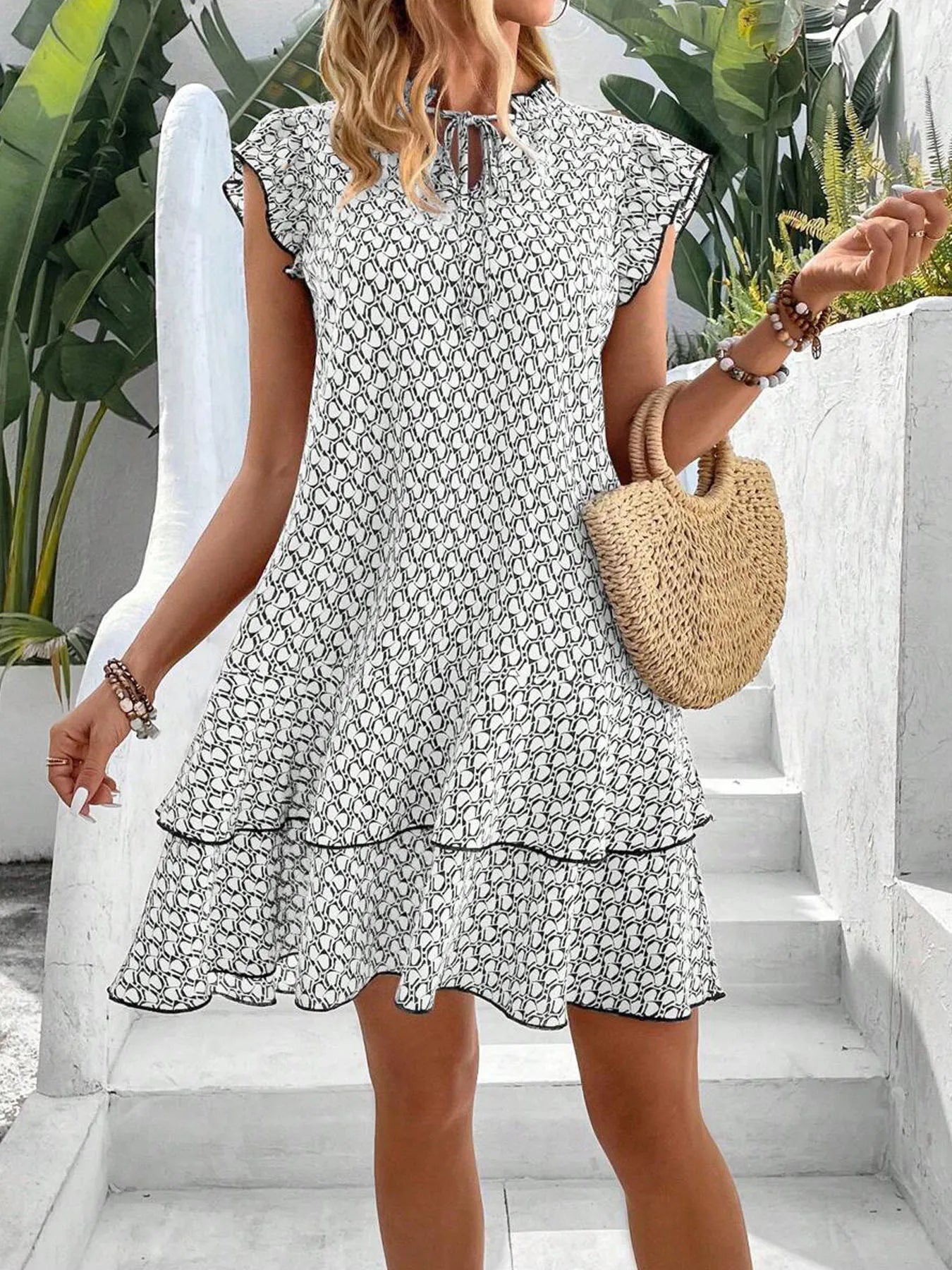 Krest elegant floral dress shown in a flattering silhouette, available in khaki, white and red