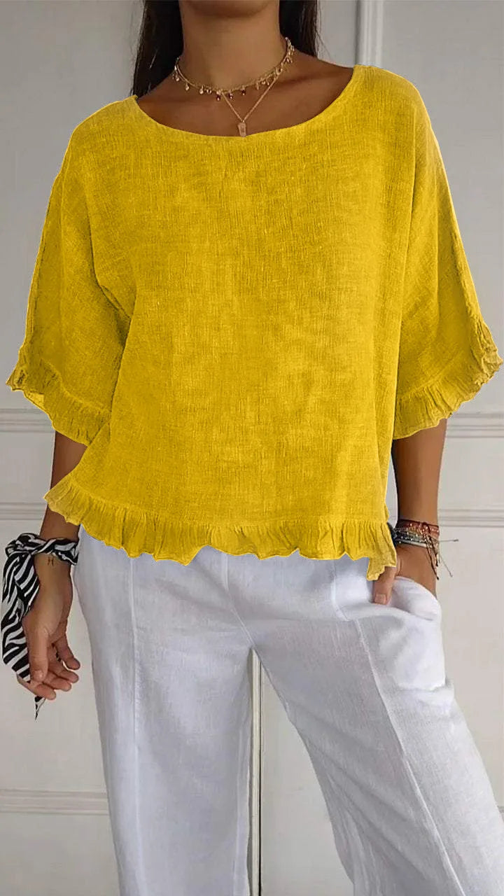 Gemma graceful everyday blouse with softly ruffled sleeves, shown in a soft feminine shade