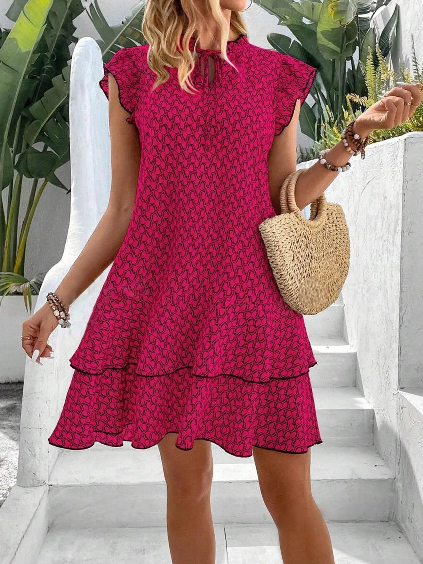 Krest elegant floral dress shown in a flattering silhouette, available in khaki, white and red