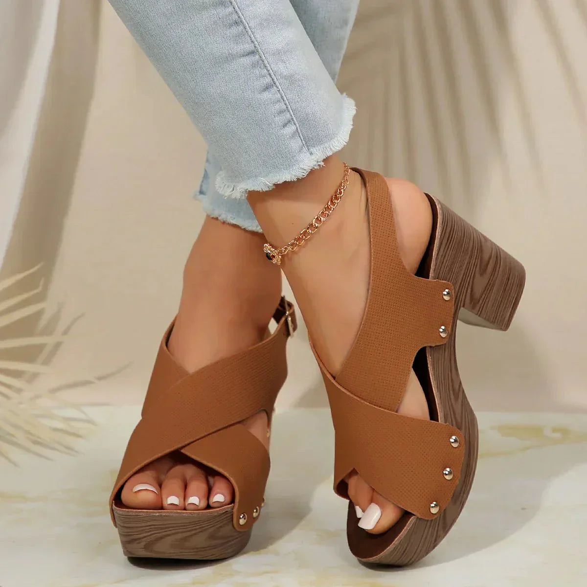 Pula Sunset platform sandals with block heel, crisscross straps and metallic rivet accents