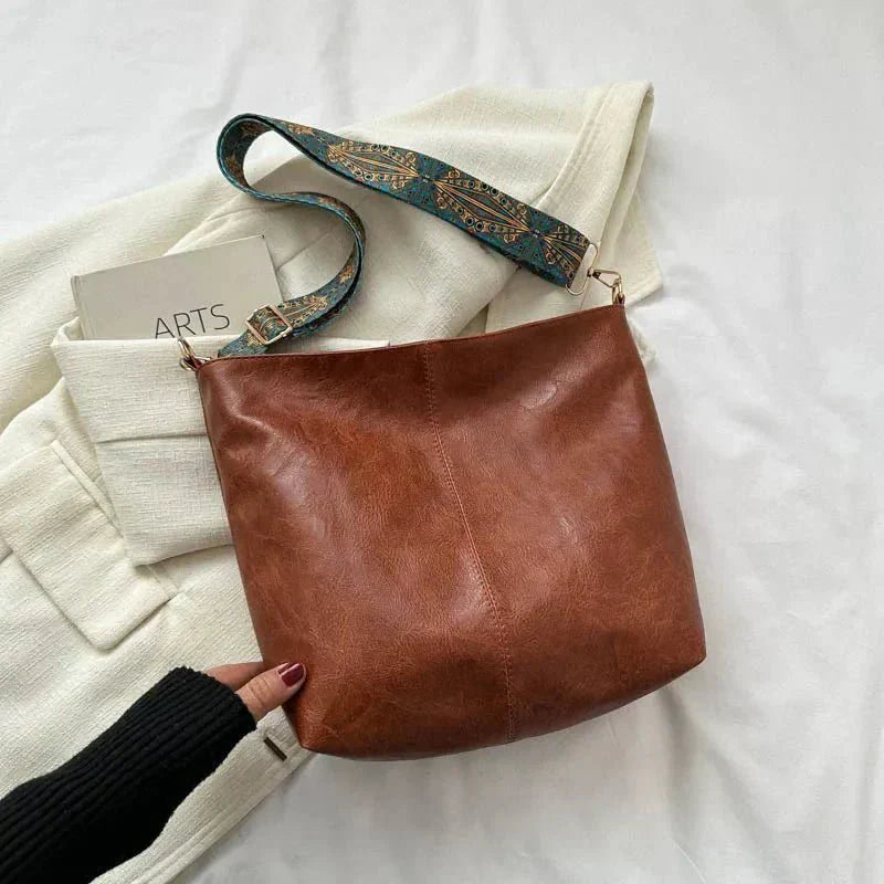 Tyla urban heritage leather shoulder bag with structured silhouette and shoulder strap