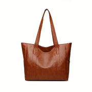 Sophia's Luxe Legacy premium leather handbag shown in Coffee and Black
