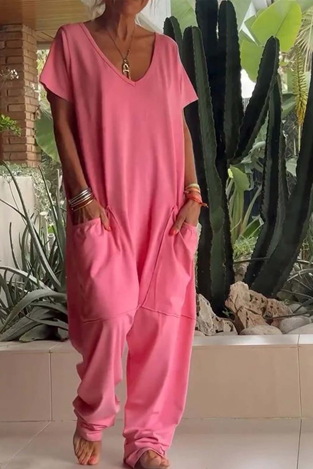 Serena relaxed-fit jumpsuit with deep V-neckline shown in a soft colourway