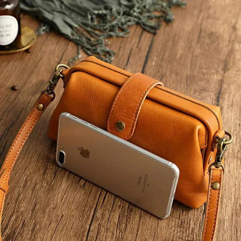 Eclipse Charm refined leather shoulder bag with vintage-inspired frame closure and copper clasp