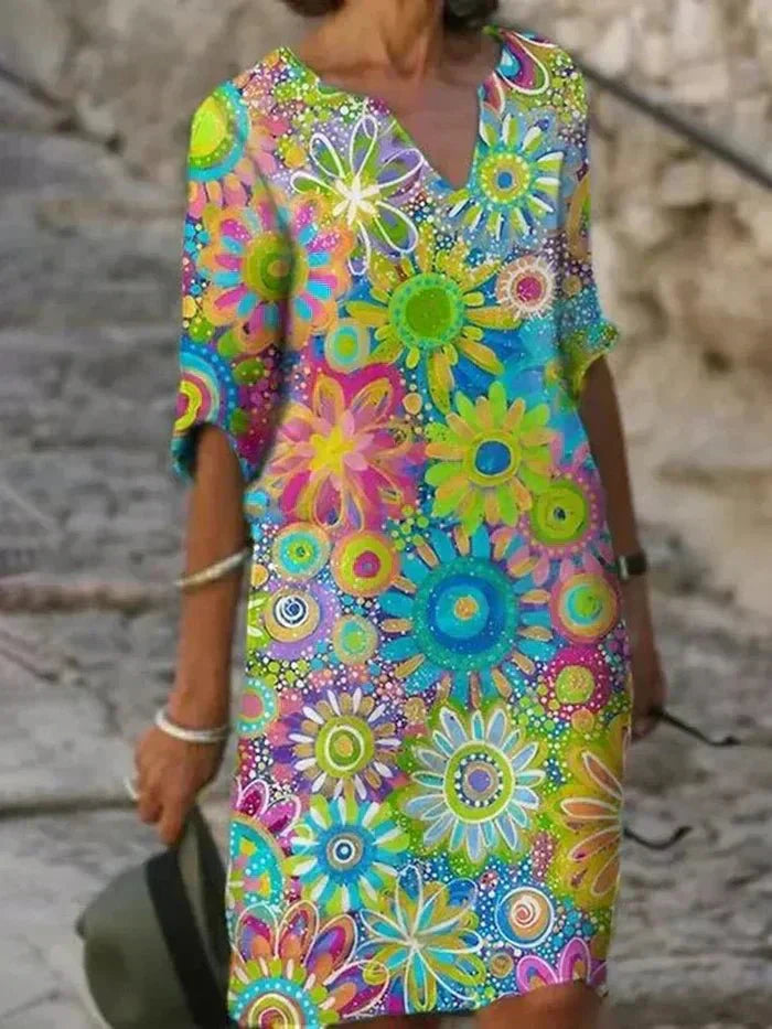 Nira vibrant floral midi dress with a flowy silhouette and colourful print
