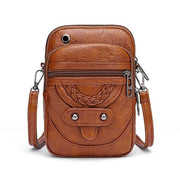 Celeste compact chic crossbody bag with adjustable strap in brown and black