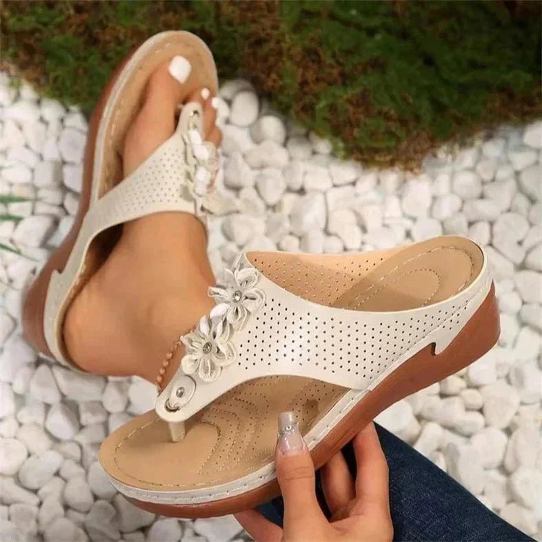 Nami orthopedic wedge sandals shown in white, blue, gold and black