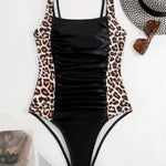 Taylor black one-piece swimsuit with adjustable double straps and sleek silhouette