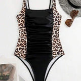 Taylor black one-piece swimsuit with adjustable double straps and sleek silhouette