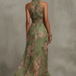 Green floral halter maxi dress with defined waist and flowing skirt