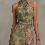 Green floral halter maxi dress with defined waist and flowing skirt