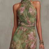 Green floral halter maxi dress with defined waist and flowing skirt