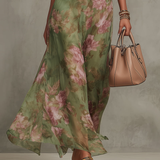 Green floral halter maxi dress with defined waist and flowing skirt