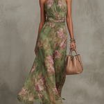 Green floral halter maxi dress with defined waist and flowing skirt