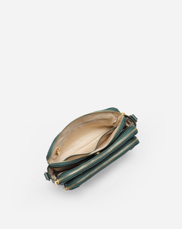 Kaya's Jewel full-grain leather shoulder bag shown in brown, blue, black and green