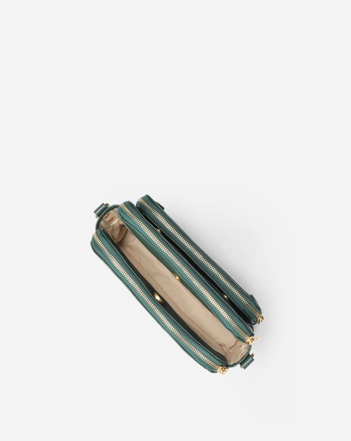 Kaya's Jewel full-grain leather shoulder bag shown in brown, blue, black and green
