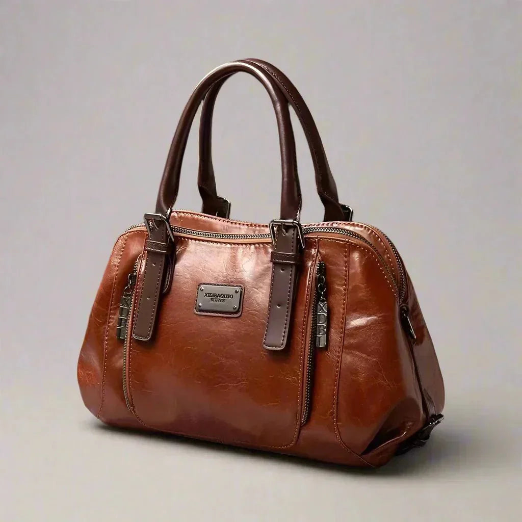 Willow signature statement handbag shown with structured silhouette and secure flap closure