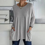 Alondra everyday pocket top with loose fit and flared hem, shown in a neutral colour