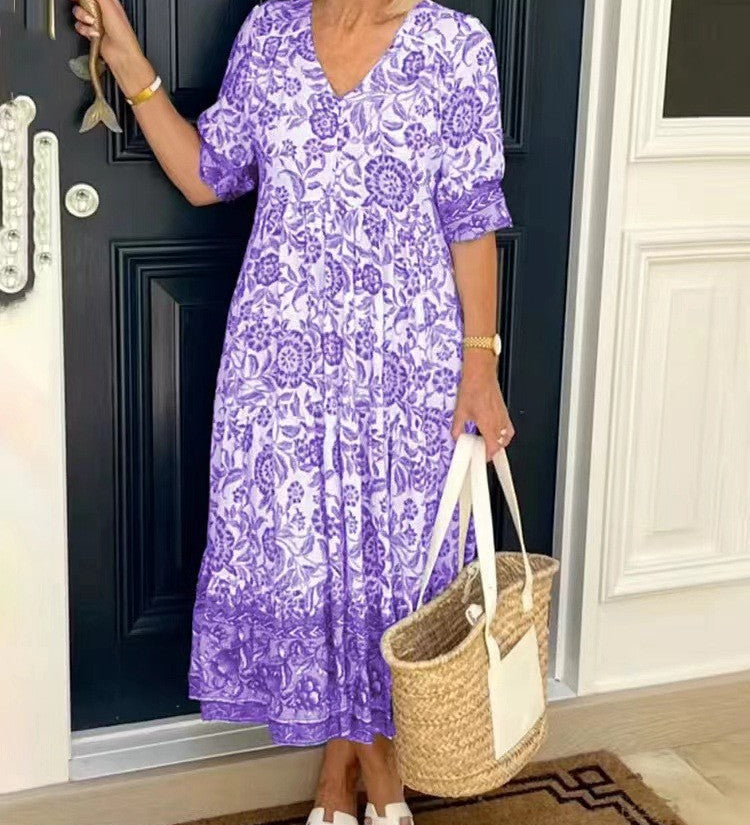 Keisha graceful V-neck floral dress shown in a soft feminine silhouette