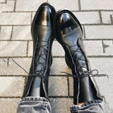 Andrea heeled boots shown in black and brown with a sleek modern silhouette