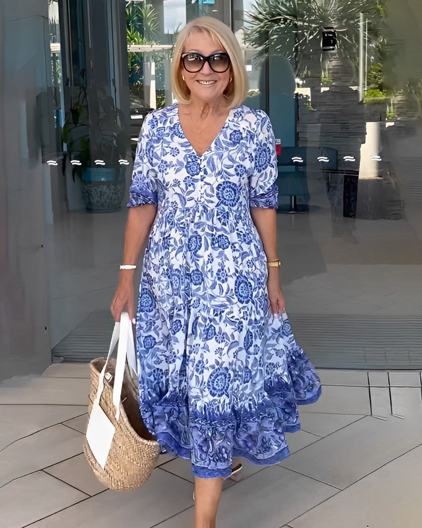 Keisha graceful V-neck floral dress shown in a soft feminine silhouette