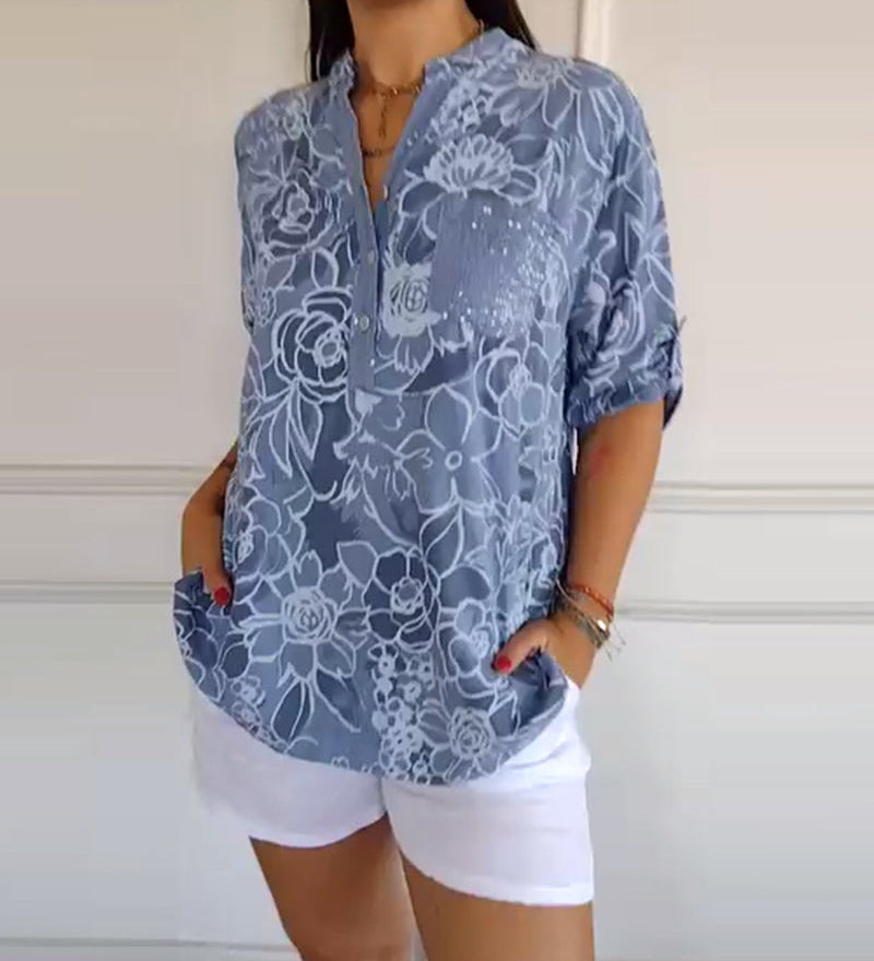 Sade floral print blouse with a relaxed, flowing silhouette in light blue
