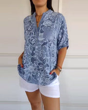 Sade floral print blouse with a relaxed, flowing silhouette in light blue