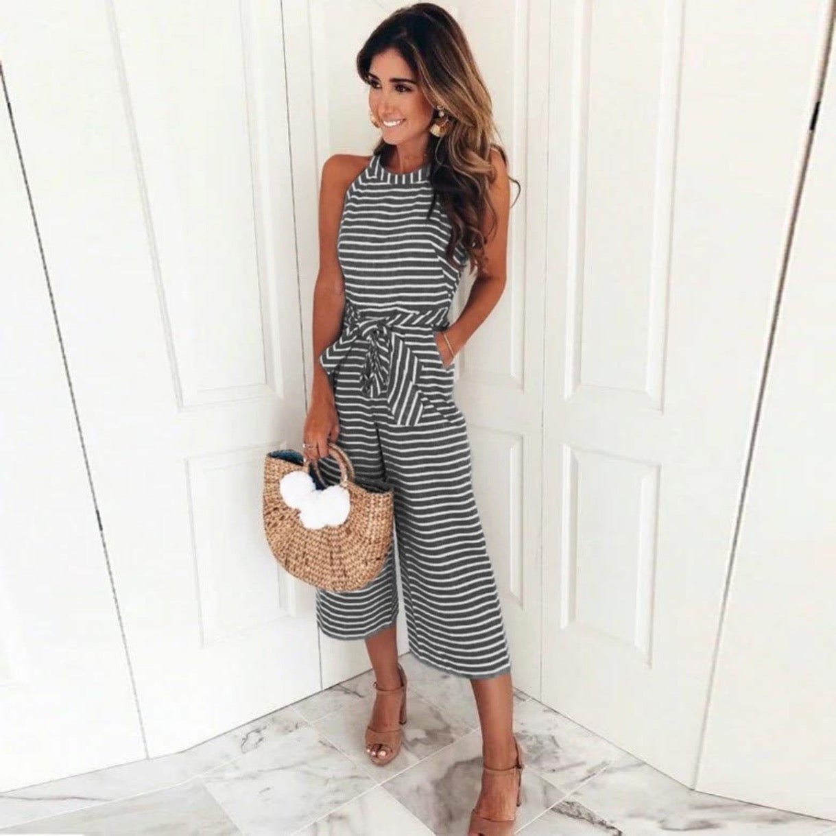 Juna striped jumpsuit shown in a relaxed, flattering one-piece silhouette