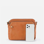 Kaya's Jewel full-grain leather shoulder bag shown in brown, blue, black and green