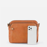Kaya's Jewel full-grain leather shoulder bag shown in brown, blue, black and green