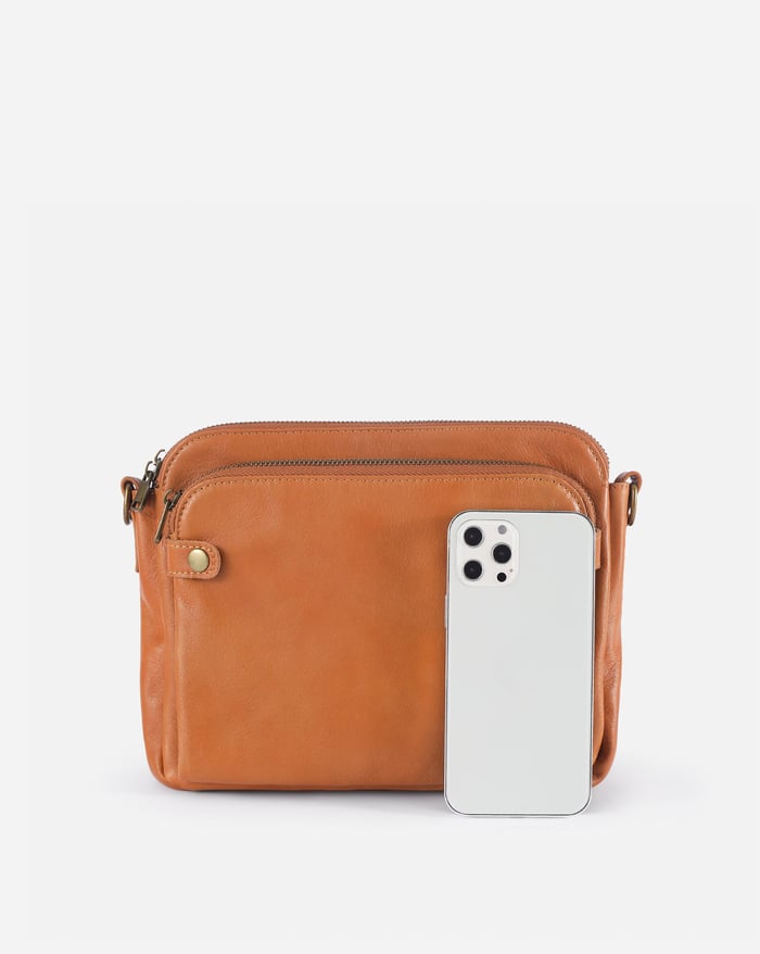 Kaya's Jewel full-grain leather shoulder bag shown in brown, blue, black and green