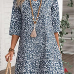 Annabelle boho floral dress with V-neckline and flowing princess-style skirt in blue and green
