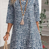 Annabelle boho floral dress with V-neckline and flowing princess-style skirt in blue and green