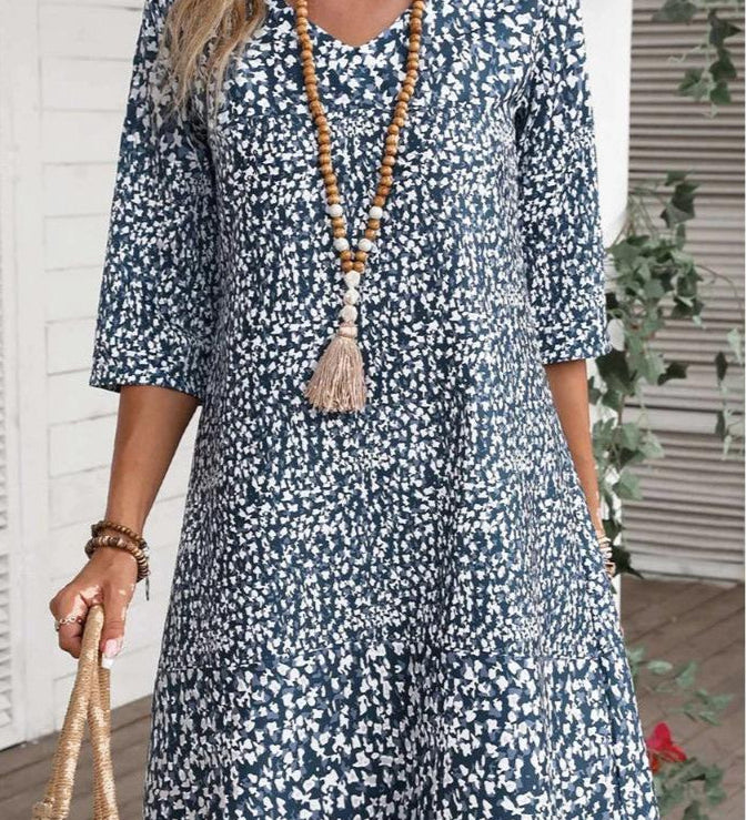 Annabelle boho floral dress with V-neckline and flowing princess-style skirt in blue and green