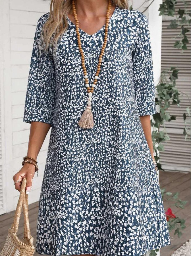 Annabelle boho floral dress with V-neckline and flowing princess-style skirt in blue and green