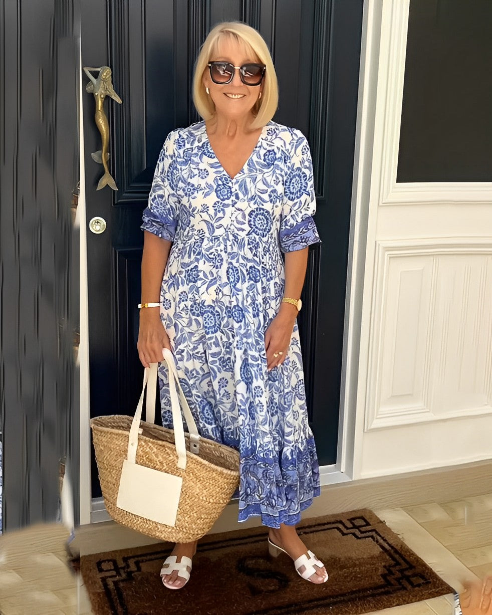 Keisha graceful V-neck floral dress shown in a soft feminine silhouette