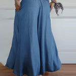 Sage flowy high-waist wide-leg pants shown in a relaxed, flattering silhouette