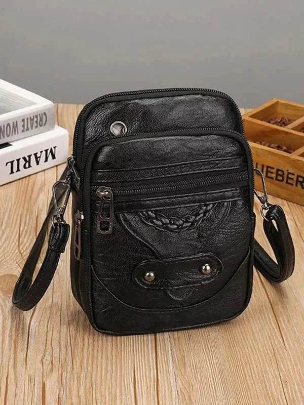 Celeste compact chic crossbody bag with adjustable strap in brown and black