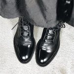 Andrea heeled boots shown in black and brown with a sleek modern silhouette