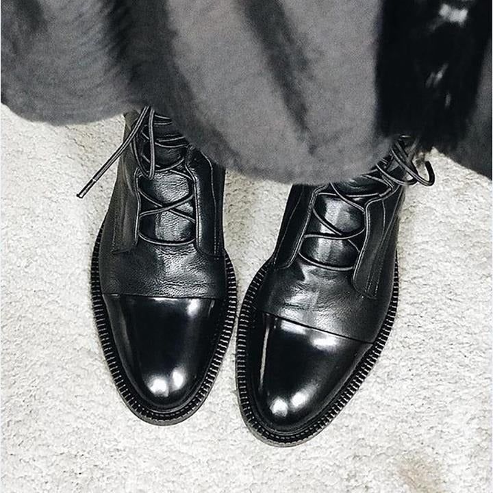 Andrea heeled boots shown in black and brown with a sleek modern silhouette
