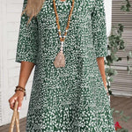 Annabelle boho floral dress with V-neckline and flowing princess-style skirt in blue and green