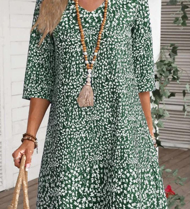 Annabelle boho floral dress with V-neckline and flowing princess-style skirt in blue and green