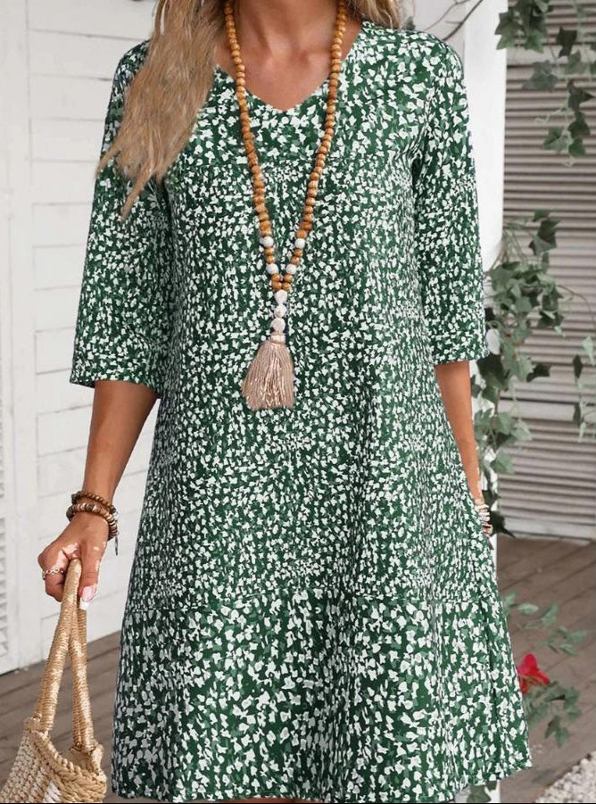 Annabelle boho floral dress with V-neckline and flowing princess-style skirt in blue and green